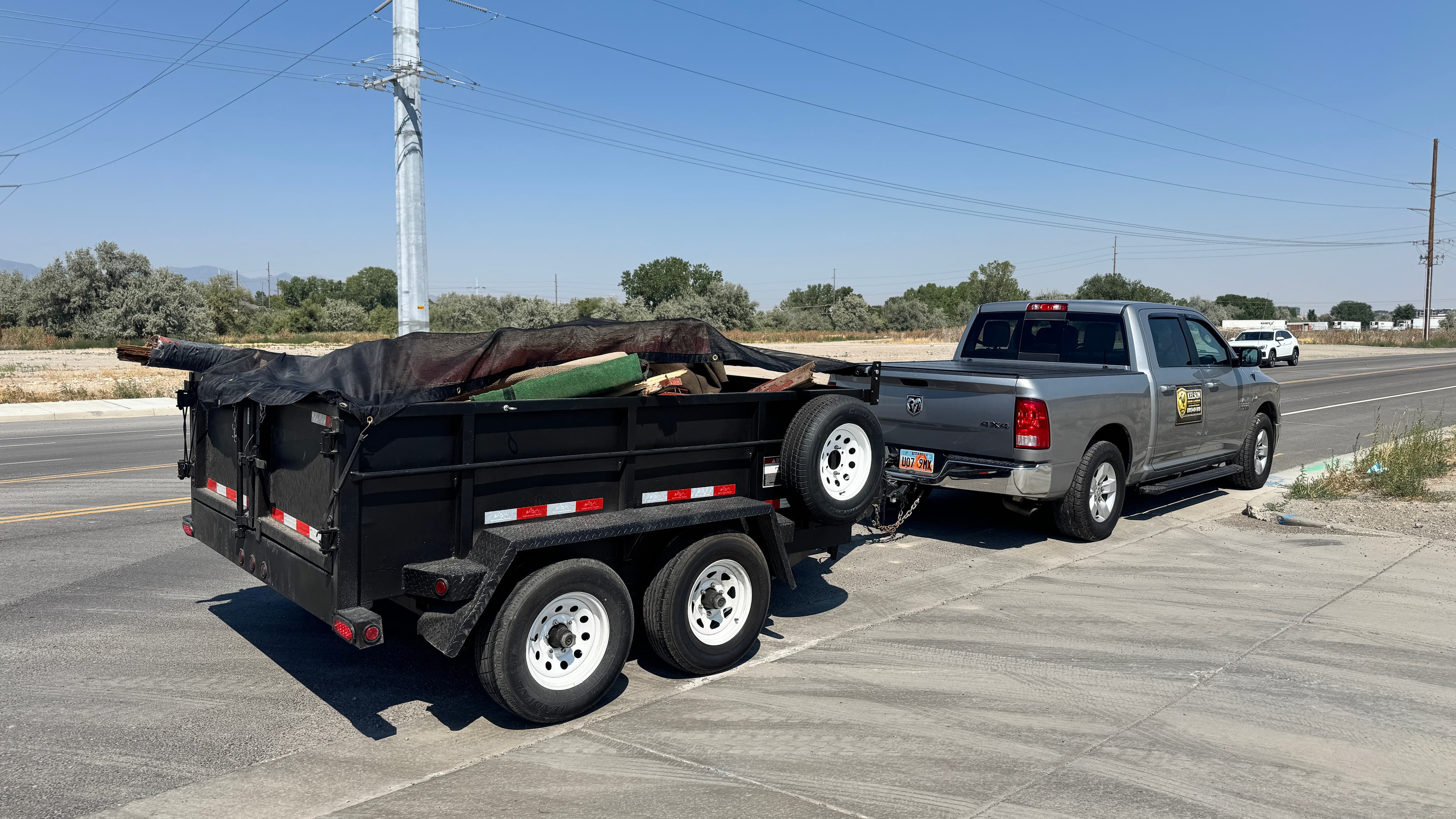 Kelson Hauling & Landscape truck and dump trailer ready for a cleanout project in the Salt Lake Valley